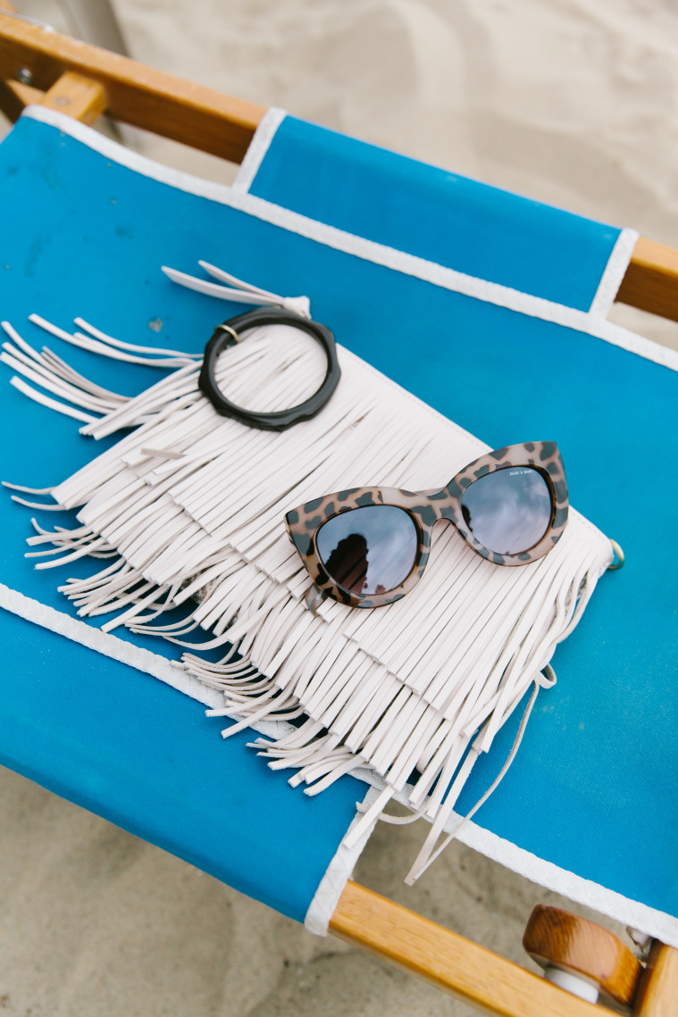 marianna hewitt what to pack for a road trip vacation revolve clothing quay sunglasses shay mitchell sam edelman fringe bag santa monica shutters beach